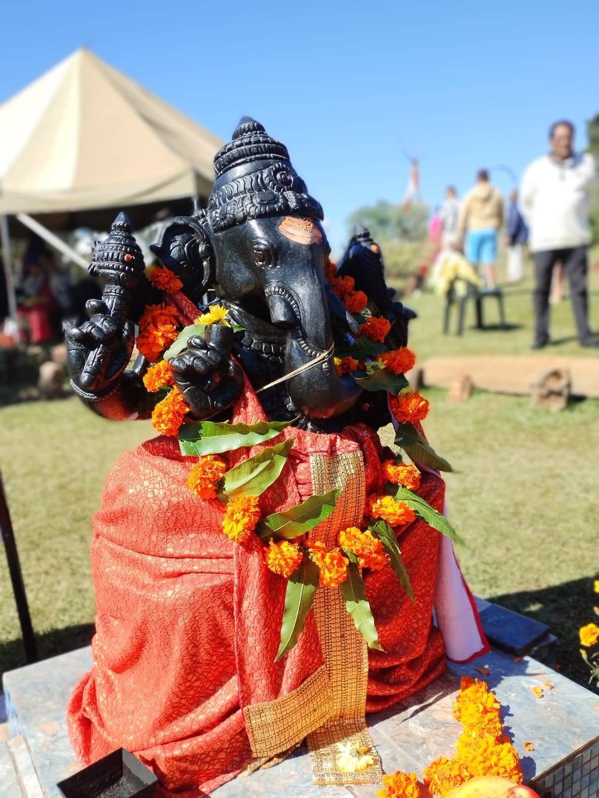 Ganesh murti decorated with garlands