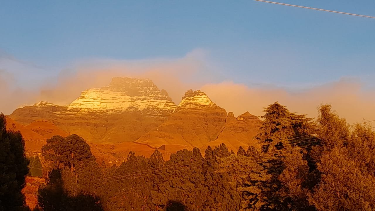 Golden sunset light over the Drakensberg mountains